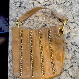 Beige and gold purse.